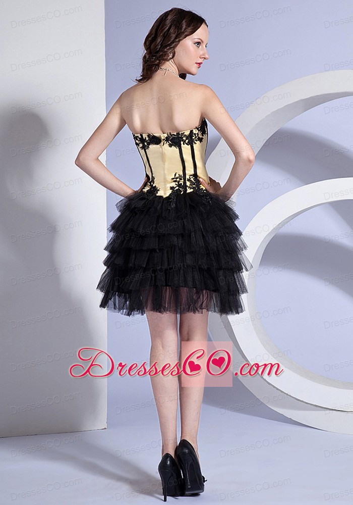 Appliques Decorate Bodice Light Yellow And Black Knee-length Ruffled Layers Prom Dress