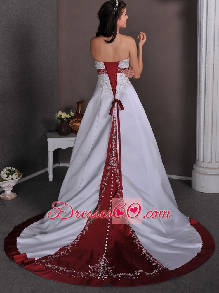 Luxurious A-line Halter Chapel Train Satin Appliques With Beading Wedding Dress